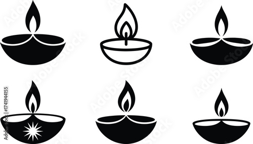 Collection of six traditional diya lamps with flames illuminated for festive celebrations