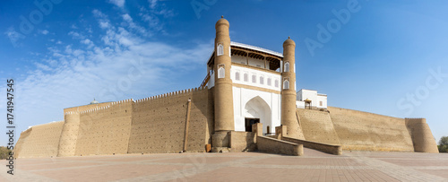 Panoramic view to the Ark of Bukhara fortress with main entrance and empty square in Bukhara, Uzbekistan. Built present structure the 16th century CE. Popular tourist attraction
