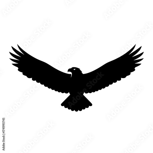Majestic black eagle silhouette soaring with outstretched wings against white background.