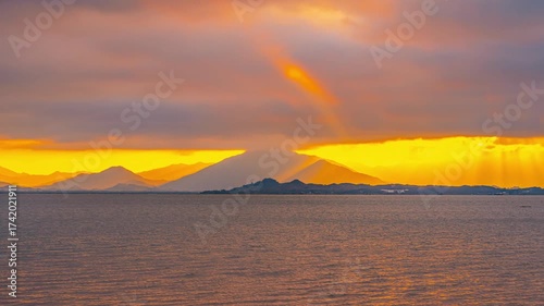 Beautiful Sunrise Time Lapse Over Shenzhen Bay with Golden Sky and Mountain Silhouettes, China