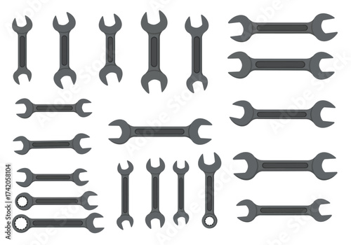 Collection of various metal wrenches tools for mechanical work.