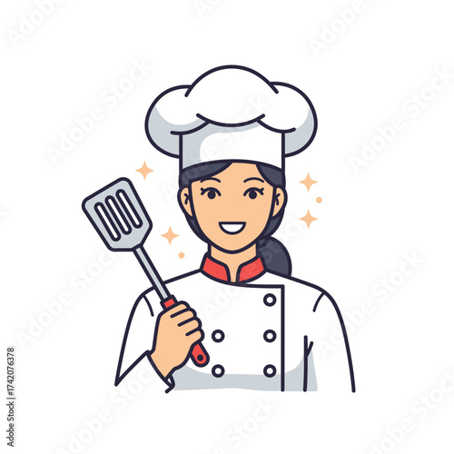 Smiling female chef in a traditional uniform holds a spatula, ready to prepare delicious food in a professional kitchen.