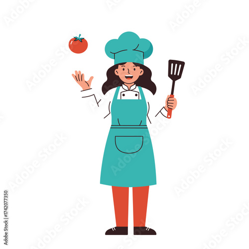 A cheerful female chef in uniform juggles a tomato while holding a spatula, ready to prepare delicious cuisine.