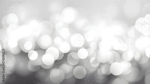 Abstract blurred bokeh lights in soft gray tones.