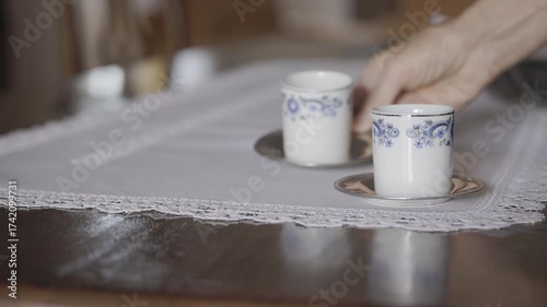 Cups of coffee on wooden table