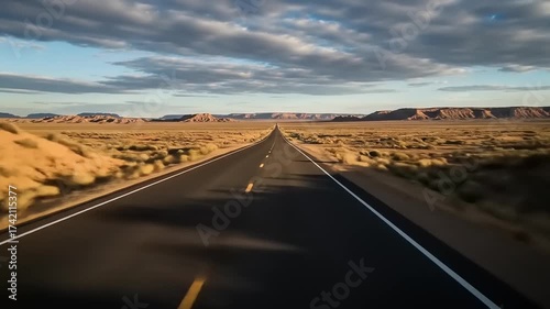 Open Road Through Desert Landscape Under Cloudy Sky, Perspective View.