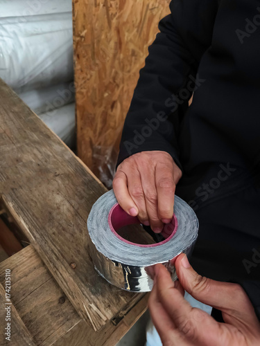 Cuadro en lienzo Butyl rubber tape with aluminum foil is used as a sealing material in roof and facade applications