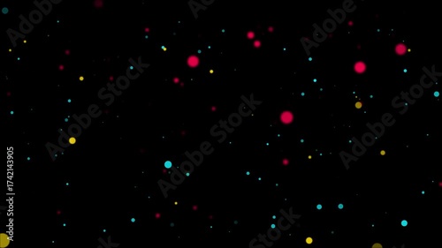 Mixed Color Particles Floating on Black Background