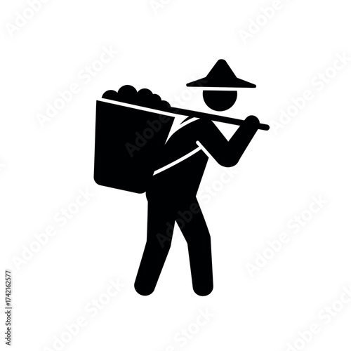 Silhouette of a person carrying a large basket of goods on their shoulder.