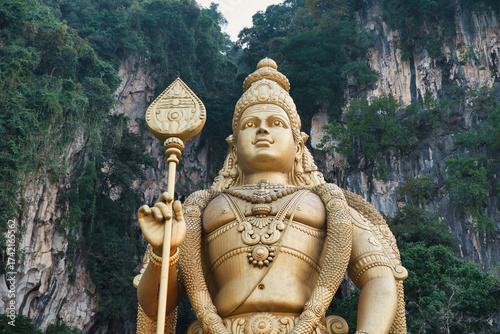 Photography The statue of the god Murugan and the entrance to the Batu Caves, near Kuala Lumpur, Malaysia