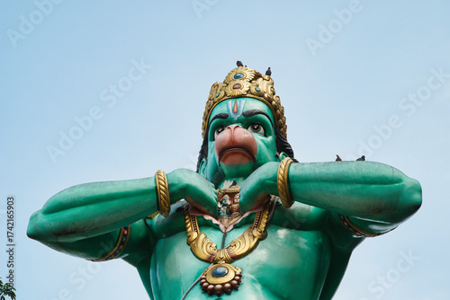 Canvas Print Detail of the statue of Hanuman, the Hindu monkey god, in the Batu Caves, Kuala Lumpur, Malaysia, and the entrance to the Batu Caves, near Kuala Lumpur