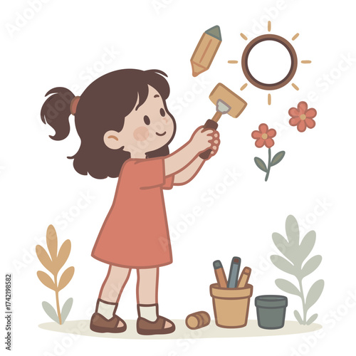 Young girl with paintbrush creating art on a wall.