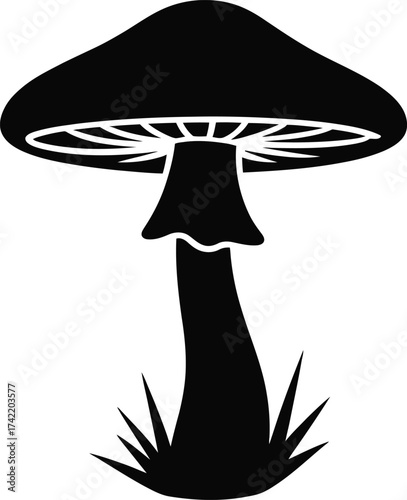 A simple black silhouette of a mushroom with gills and a stem growing from grass