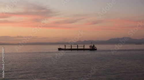 Oil petroleum tank ship sail on wild ocean sea at sunset time, global logistics water tranportation, 4k