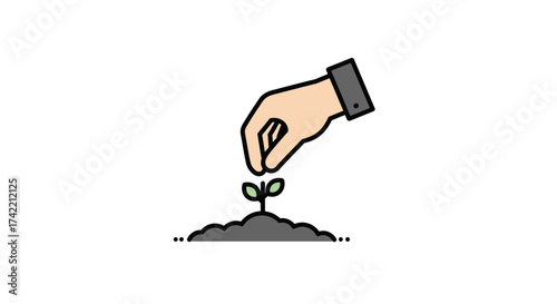 Hand nurturing a small plant sprout in a mound of soil.