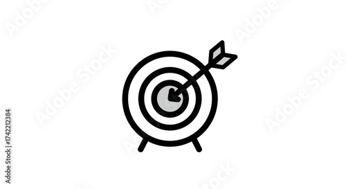 Target with arrow hitting bullseye representing business goal achievement and success.