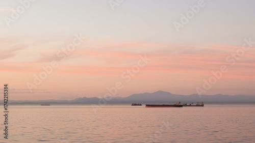 Oil petroleum tank ship sail on wild ocean sea at sunset time, global logistics water tranportation, 4k