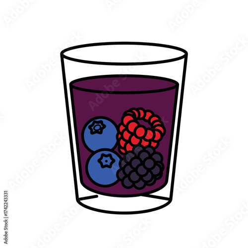 Berry smoothie in a glass with blueberries raspberries and blackberries.