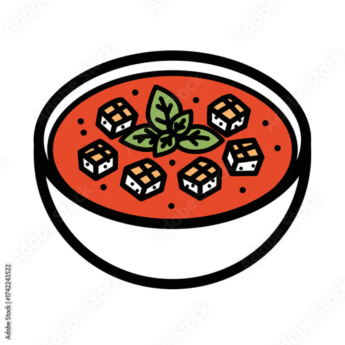 Delicious tomato soup with basil and croutons in a bowl.