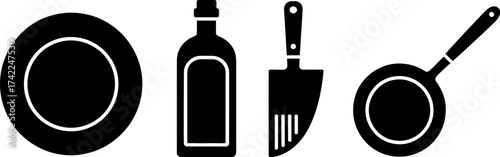 Essential kitchen tools including a plate, bottle, spatula, and frying pan for cooking and food preparation