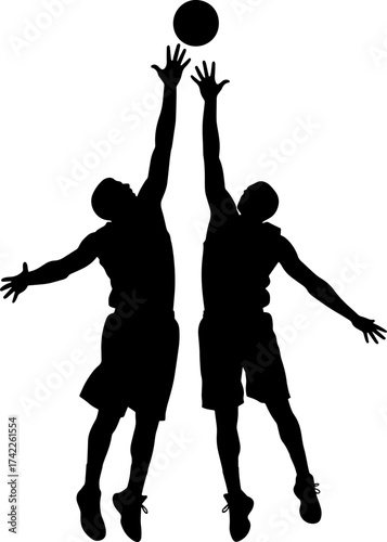 Basketball players in silhouette jumping for a rebound during a game