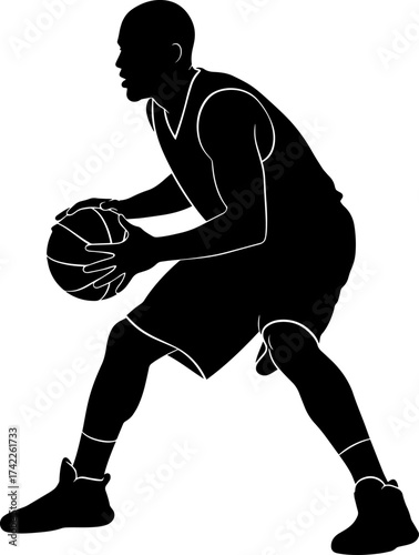 Silhouette of a basketball player dribbling the ball in motion