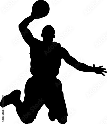 Silhouette of a basketball player performing a powerful slam dunk in mid air