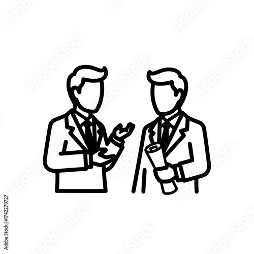 Two businessmen in suits discussing a project or deal together.