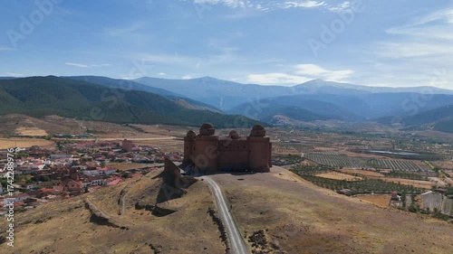 Aerial view of the Renaissance castle of La Calahorra in Granada, Andalusia, Spain, with the Sierra Nevada in the background