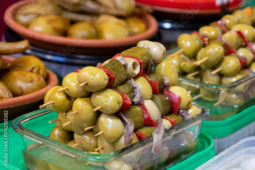 pickled banderillas, a traditional Spanish product with olives, gherkins, peppers, and anchovies