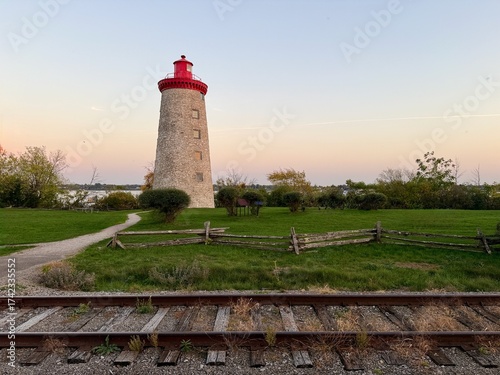 A stone lookout tower on a sunny fall day