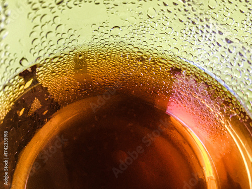 Cold peach iced tea seen from inside the glass