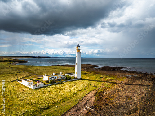 Rain Clouds over Barns Ness Lighthouse from a drone, Dunbar, East Lothian, Scotland, UK