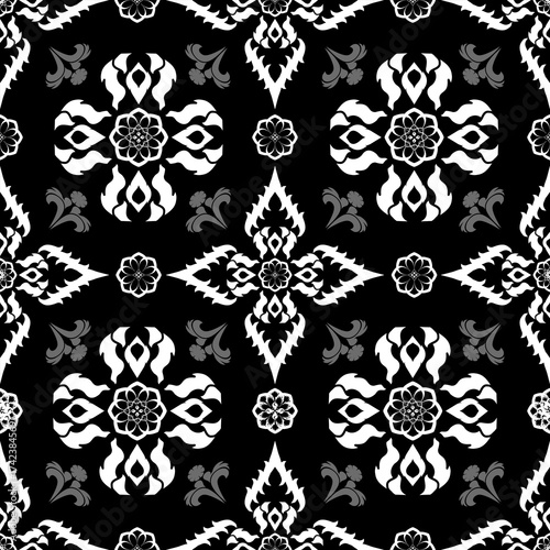 Monochrome Thai damask pattern in white and gray on black background. It conveys a timeless, classic, and minimal elegance, perfect for monochrome fashion, interior design, or elegant print materials.