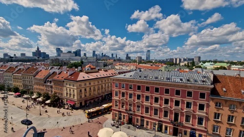 Warsaw, Poland  August 2, 2023: time lapse. Old Town with landmark red roofs and downtown business district with skyscrapers