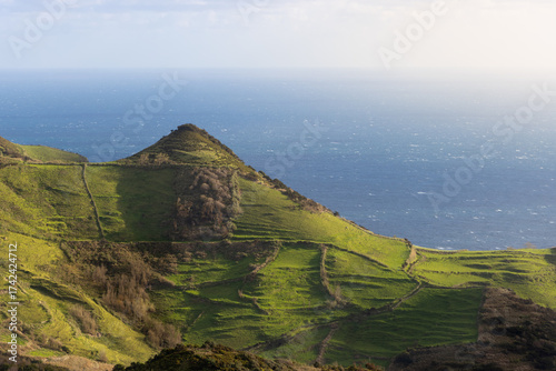 Epic coast with lush green meadows on Flores island, part of the Azores archipelago
