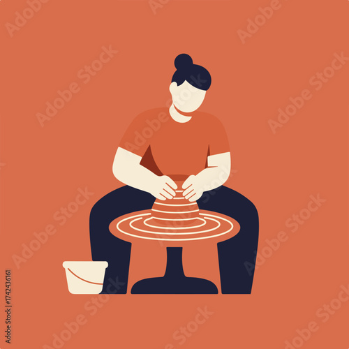 Person crafting clay on a wheel with a bucket nearby