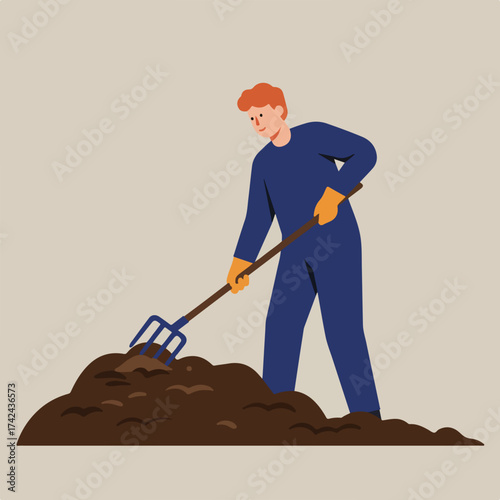 Person in blue overalls and orange gloves using a pitchfork to move soil