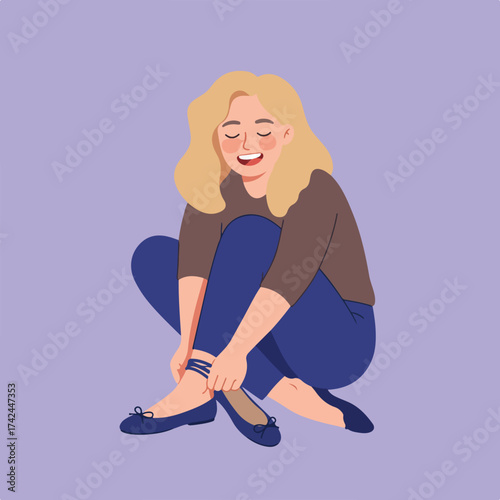 A happy woman with blonde hair is tying her shoe while sitting down