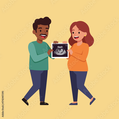 A couple joyfully holds up an ultrasound image of their unborn baby