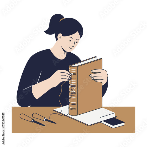A person is carefully sewing a book with a needle and thread on a table