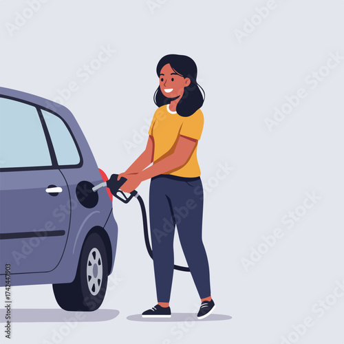 Smiling person fueling a vehicle at a gas station