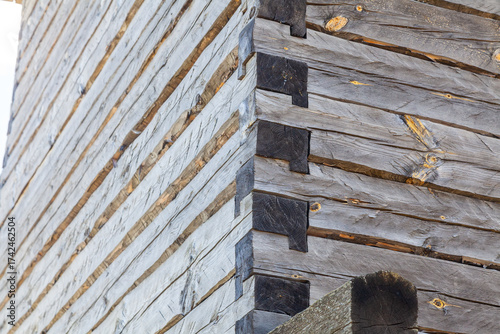 Wooden log cabin corner joinery lap joint close up