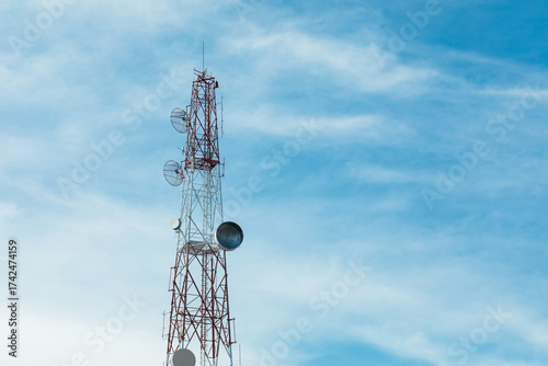 Telecommunication Signal Tower with Antennas against Blue Sky