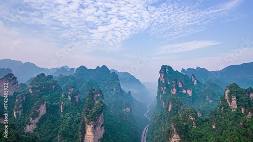 Aerial view of Baizhangxia canyon landscape in Zhangjiajie National Park, China with dramatic rock formations and misty atmosphere