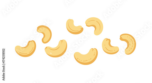 A scattering of golden cashew nuts against a plain white background