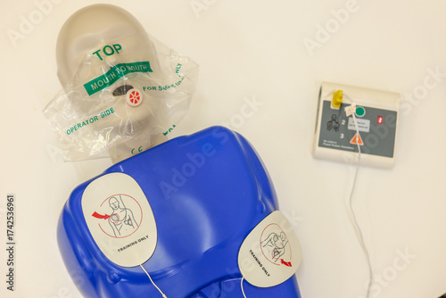 Mannequin for practicing cardiopulmonary resuscitation (CPR) techniques with a defibrillator