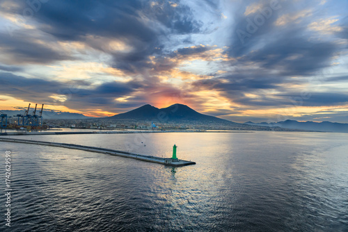 Cityscape of Naples with the port and Mount Vesuvius at sunset, southern Italy.