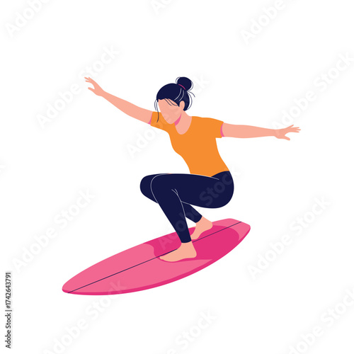 Young woman balancing on a surfboard riding a wave during a surfing lesson.