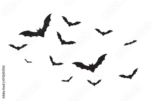 Silhouette of a flock of bats flying against a white background